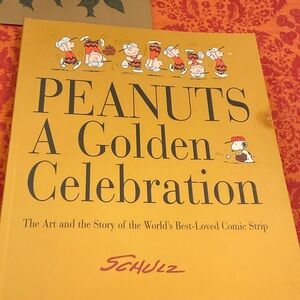 Peanuts A Golden Celebration Book. First Edition 1999. Mint except candle stain.